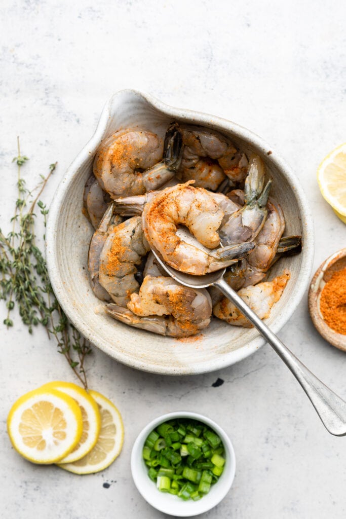 shrimp in bowl with cajun seasoning
