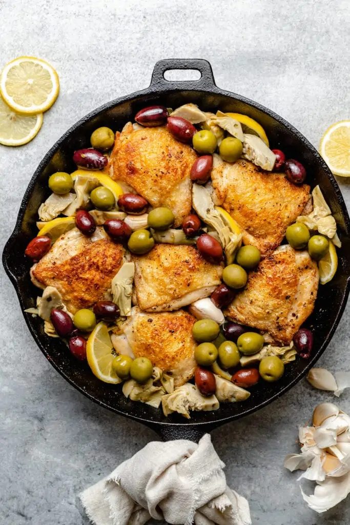 chicken in skillet with olives