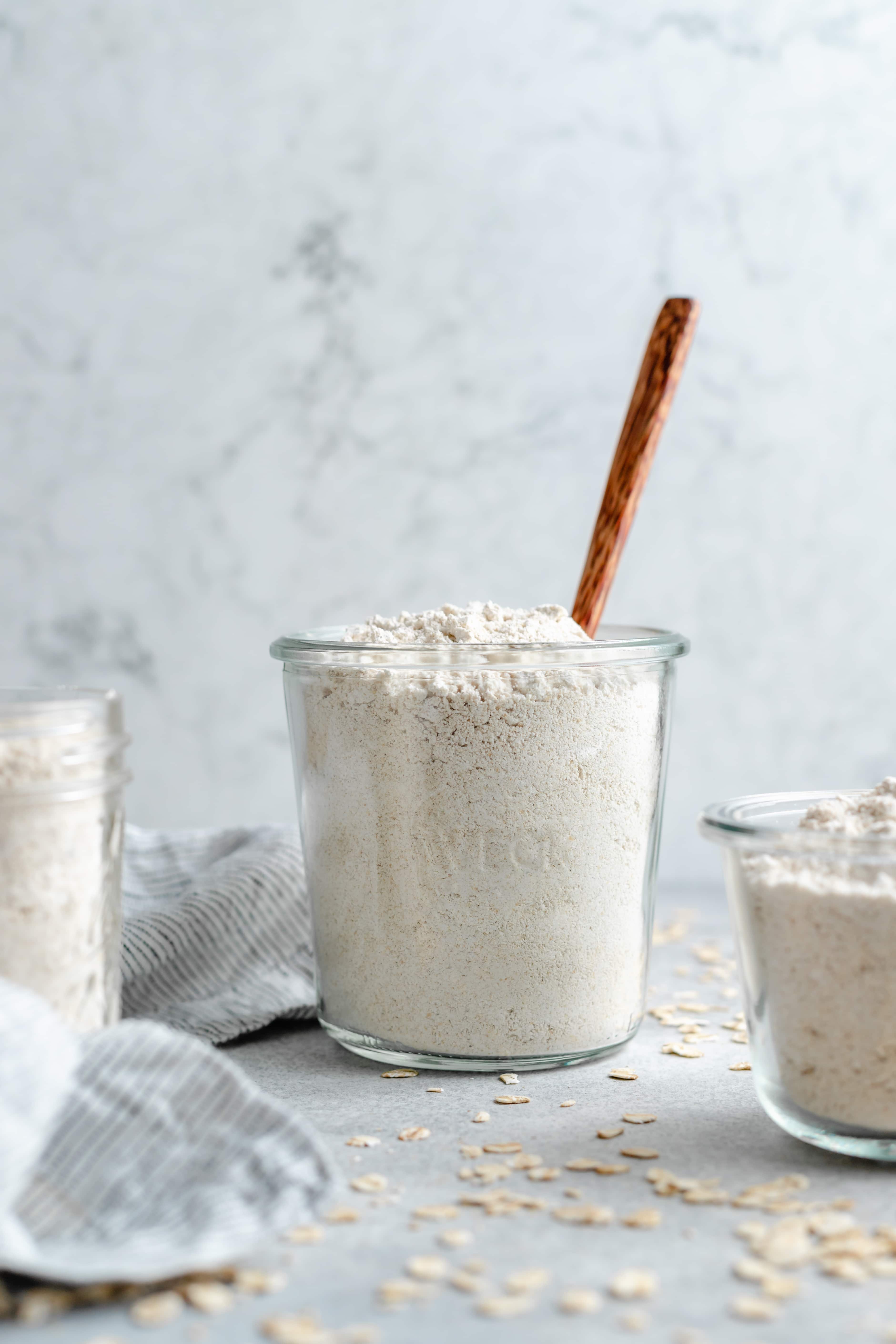 oat flour in glass with spoon