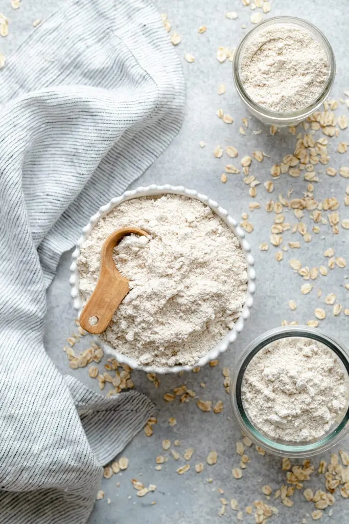 oat flour in bowl with measuring spoon