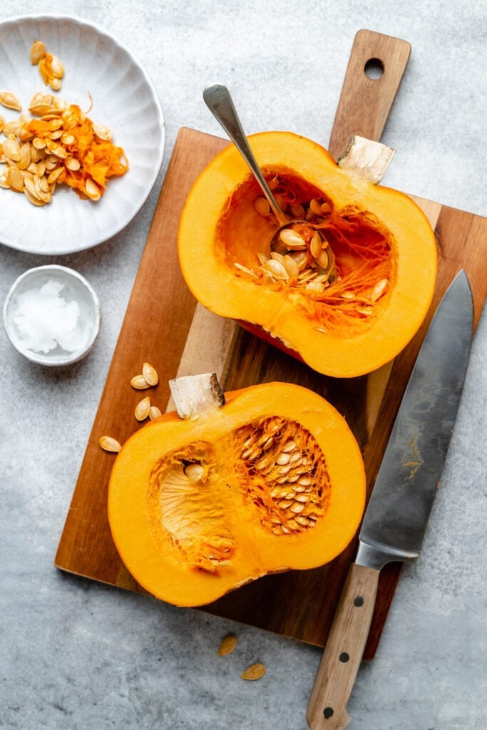 raw pumpkins on cutting board