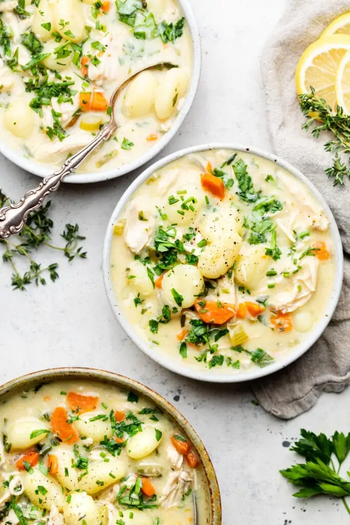 chicken gnocchi soup in three bowls