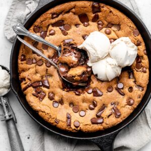 skillet cookie with ice cream and spoons