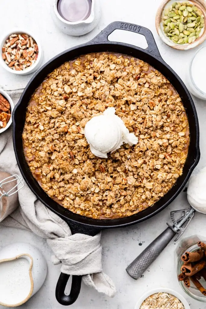 baked pumpkin crisp topped with ice cream