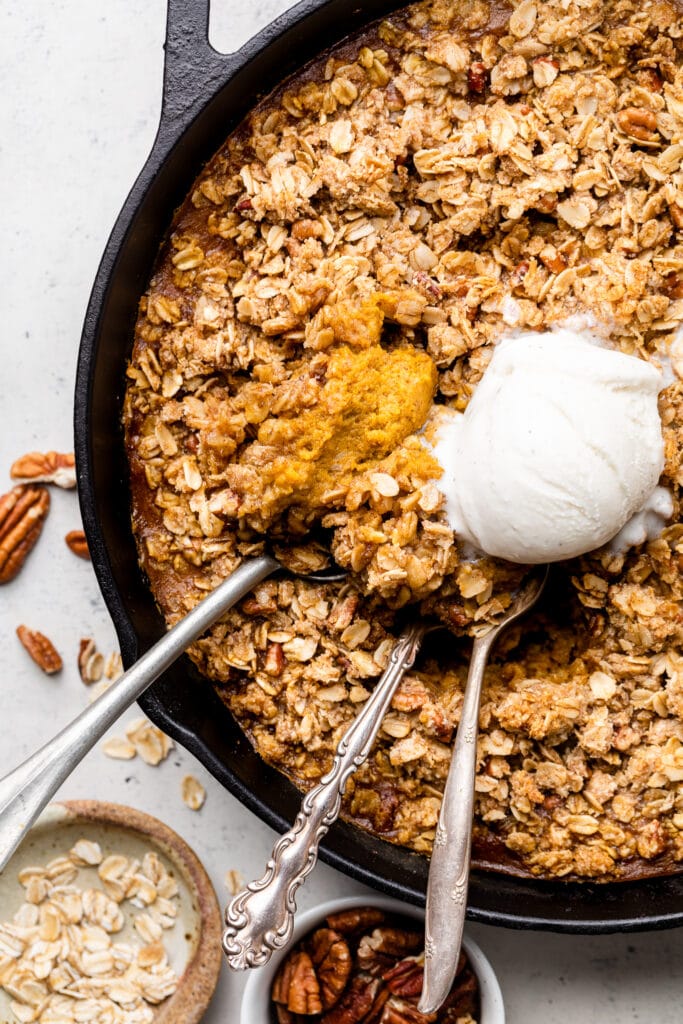 baked crisp in skillet with ice cream