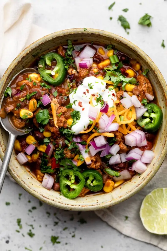 healthy turkey taco soup in bowl with spoon
