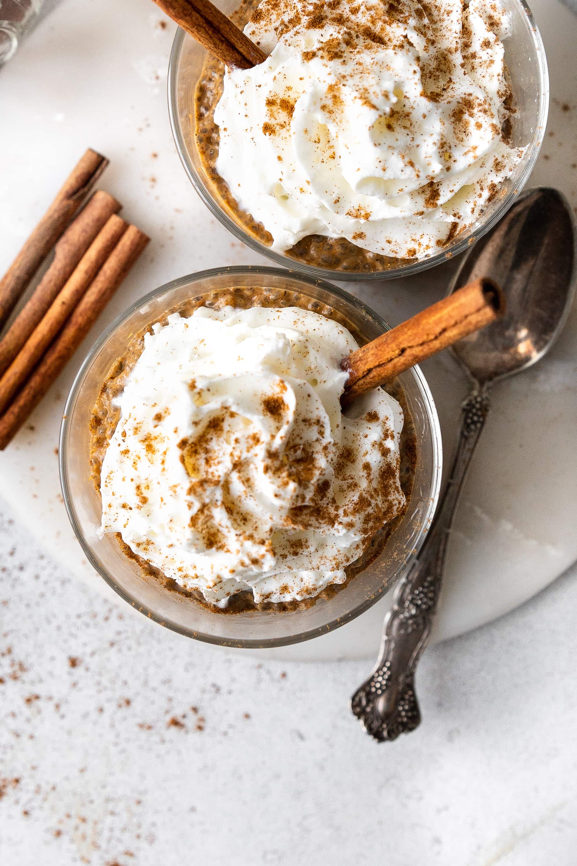 pumpkin chia pudding in bowl with whipped cream