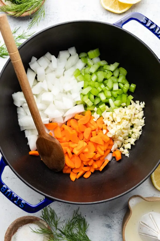 onion, celery, carrot, and garlic in pot