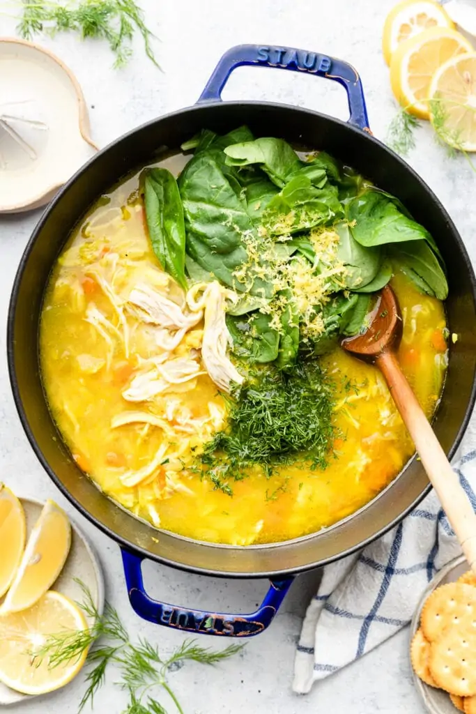 lemon chicken orzo soup in pot with spoon