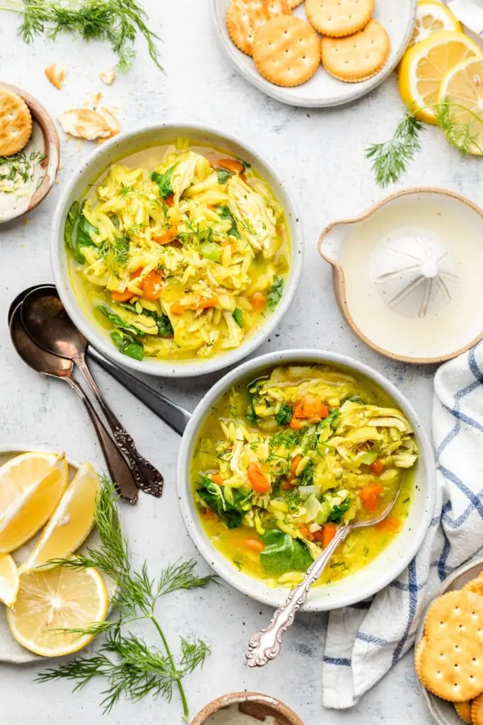 lemon chicken orzo soup in two bowls