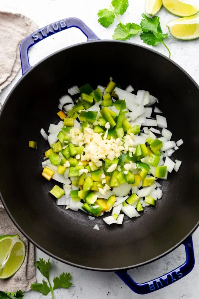 peppers, onion, and garlic in pot