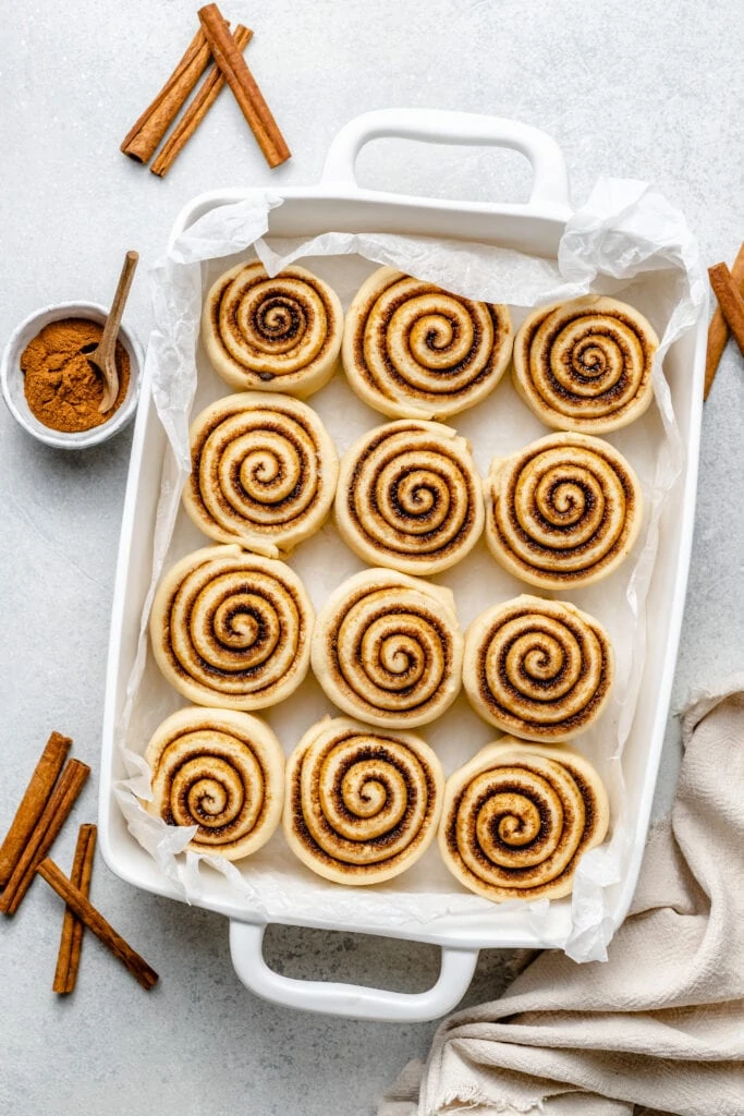 cinnamon rolls in pan after rise