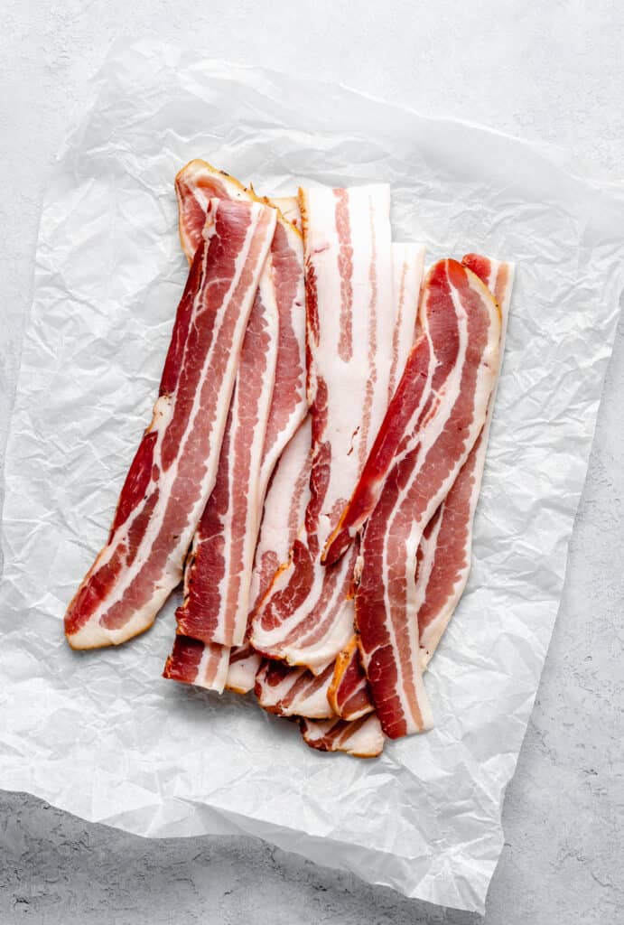 raw bacon on parchment