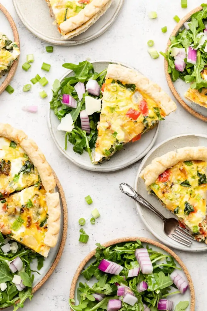 breakfast quiche on plates with salad