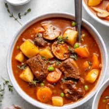 Healthy Whole30 beef stew with mushrooms, carrots, and celery in a pot