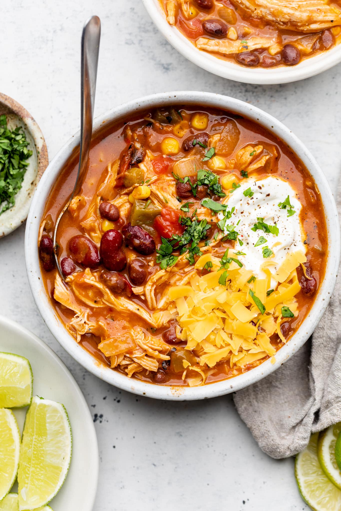chicken enchilada soup in bowl with spoon