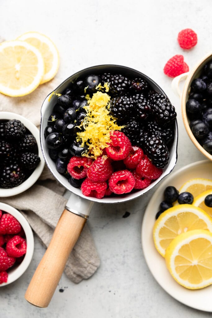 berries in pot with lemon zest