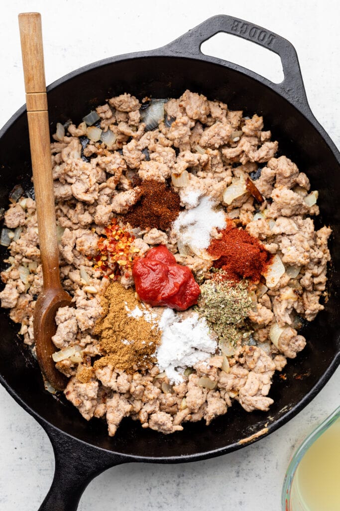 ground turkey and spices in skillet