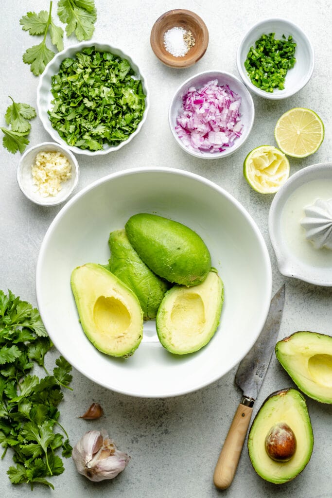 avocado halves in bowls