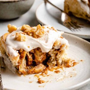 banana cinnamon rolls with icing and nuts
