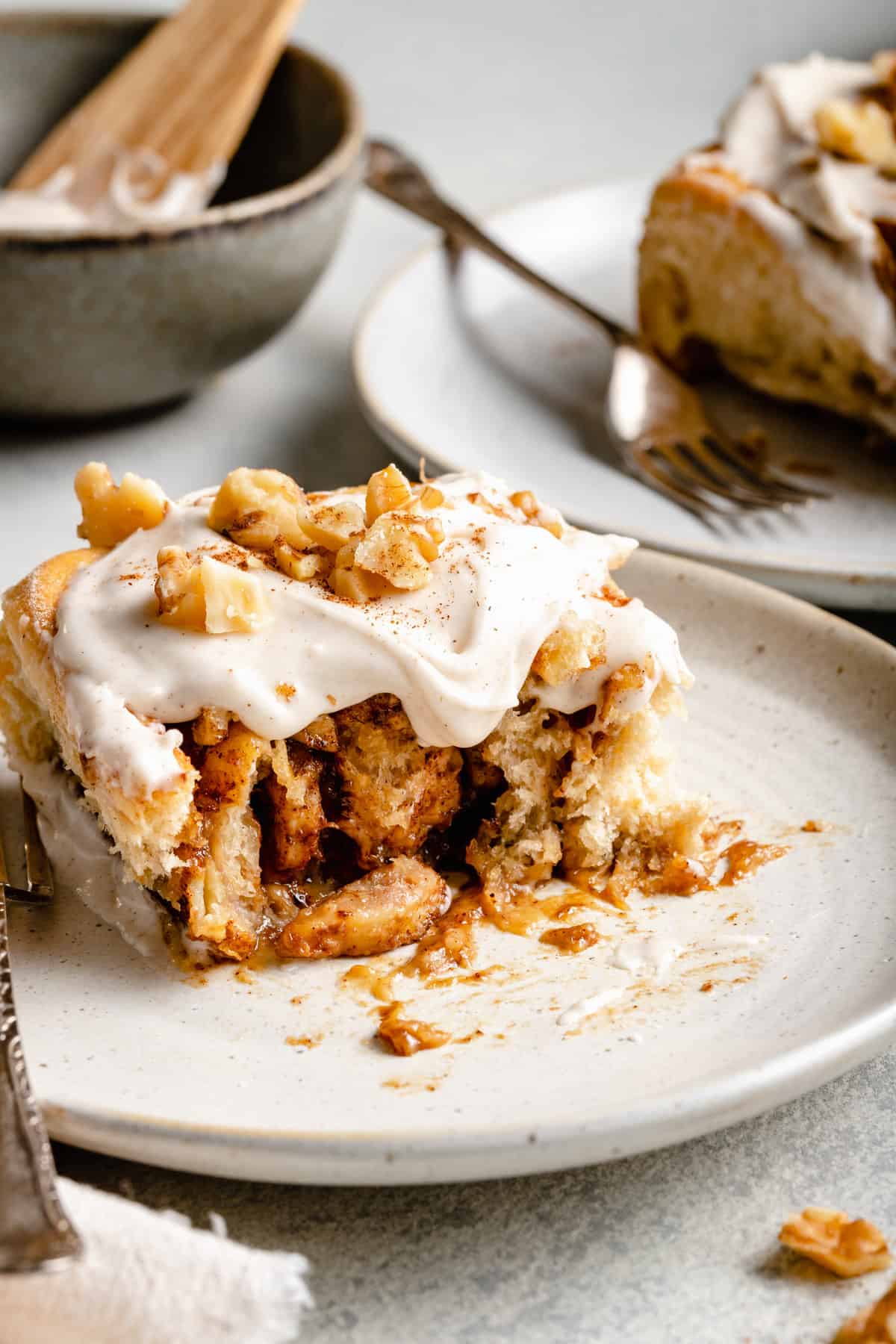 banana cinnamon rolls with icing and nuts