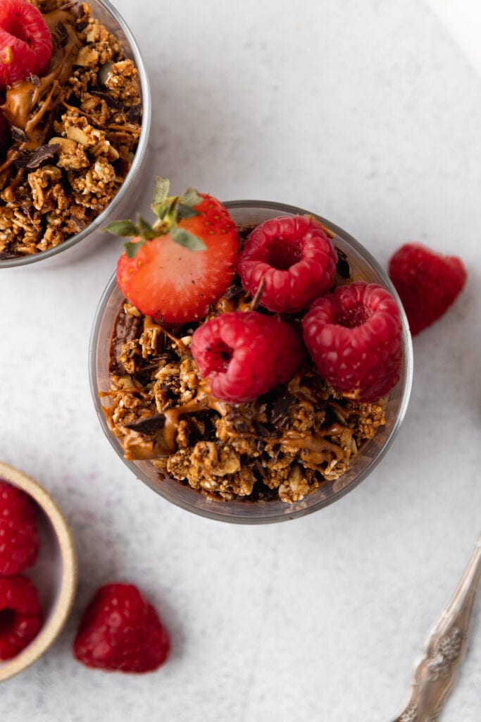 chocolate chia pudding topped with granola and berries