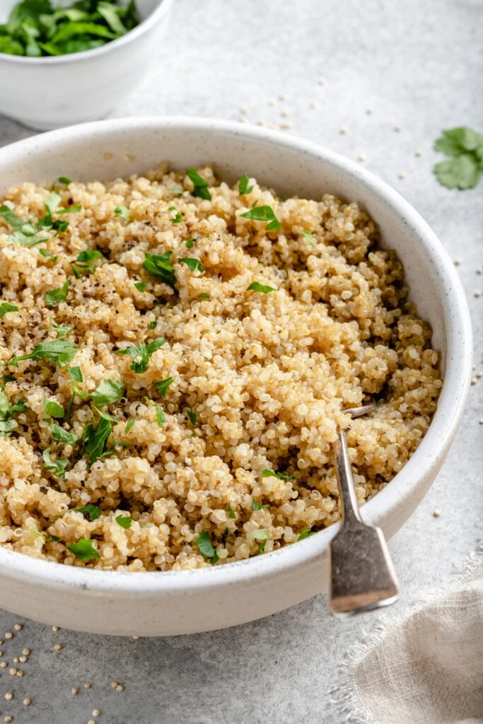 cooked quinoa in bowl with fork