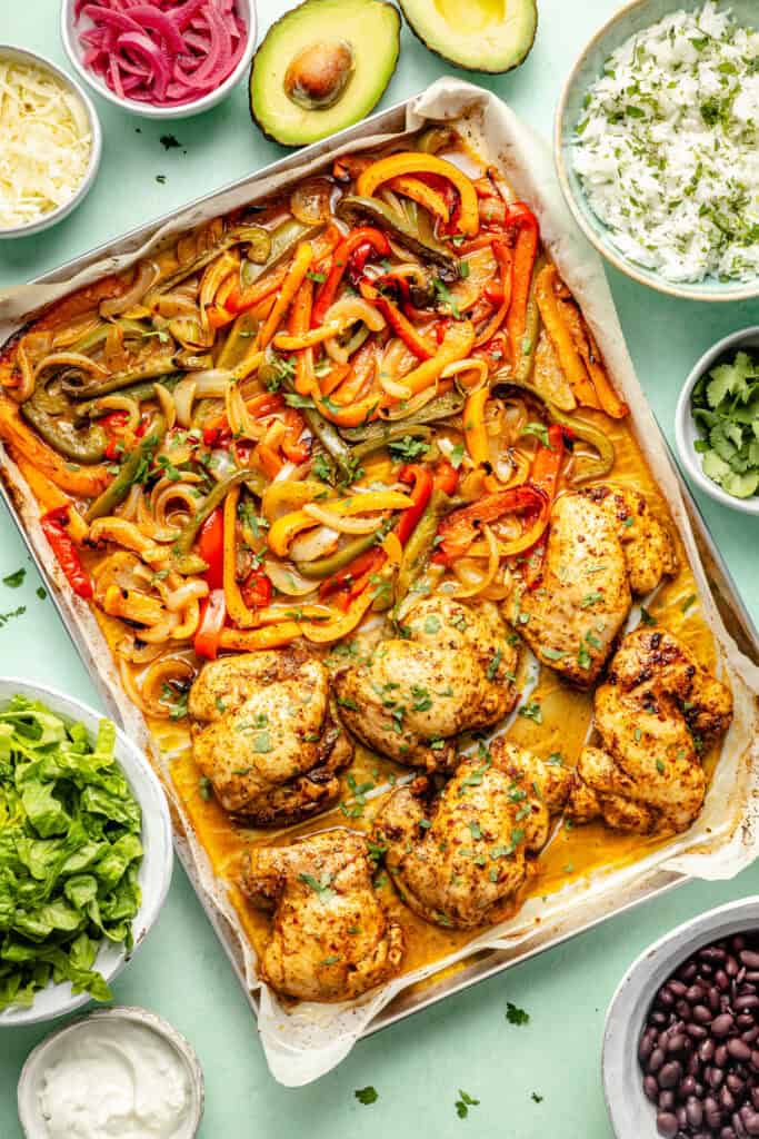 cooked chicken and veggies on sheet pan