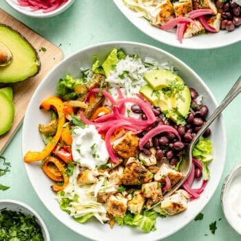 sheet pan chicken burrito bowl with fork