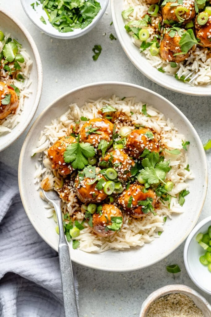 meatballs over rice in bowls