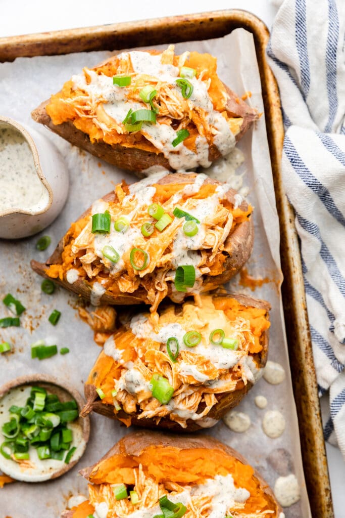 Slow Cooker Buffalo Chicken Stuffed Sweet Potatoes - All the Healthy Things