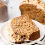 thick slice of carrot cake bread on plate with fork