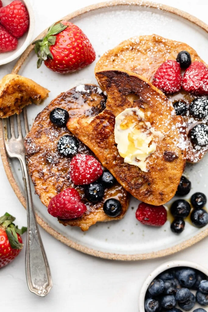 French toast on plate with berries