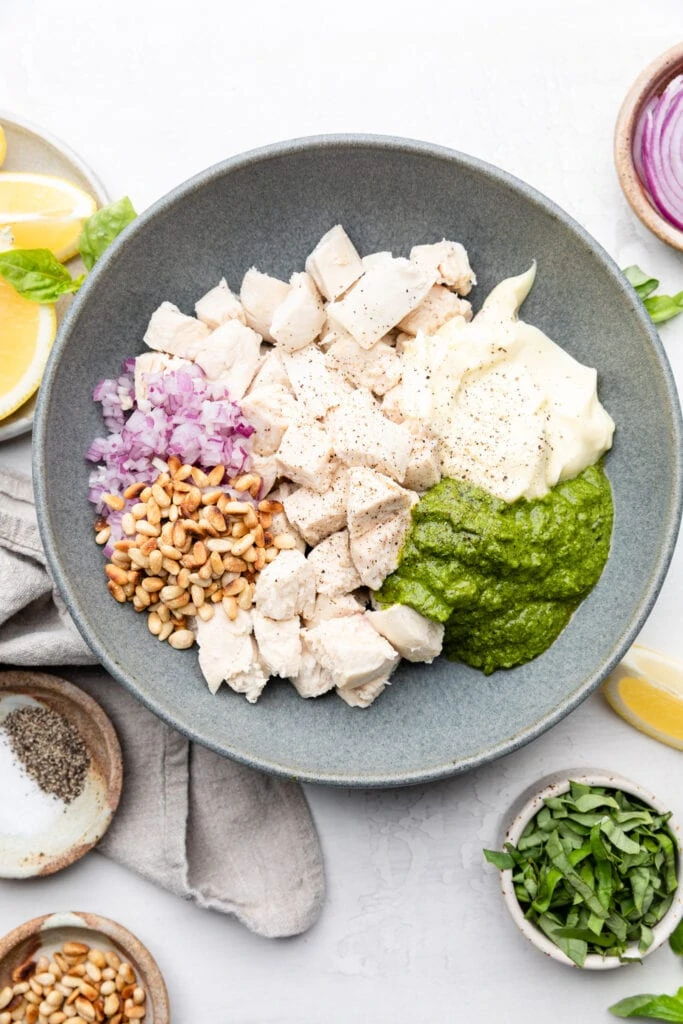 pesto chicken salad ingredients in bowl