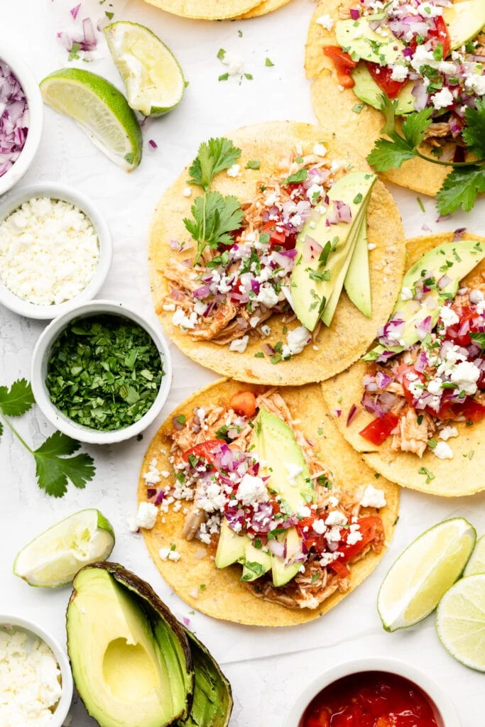 slow cooker chicken tacos with toppings