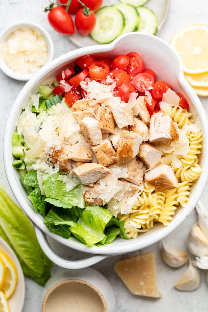 pasta salad ingredients in mixing bowl