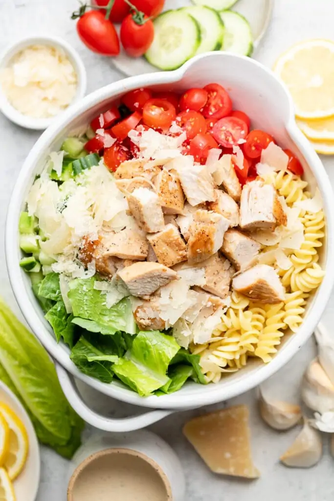 pasta salad ingredients in mixing bowl