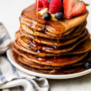 oatmeal pancakes on plate with syrup