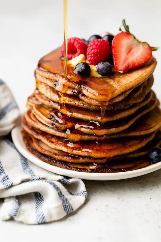 oatmeal pancakes on plate with syrup