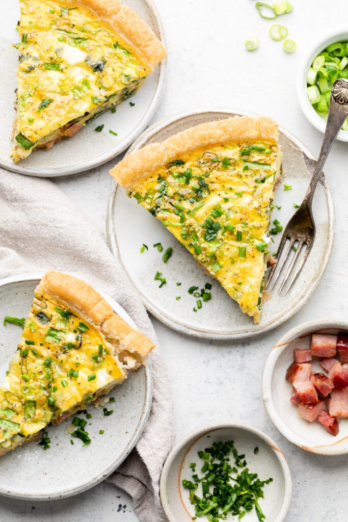 ham and spinach quiche on plate