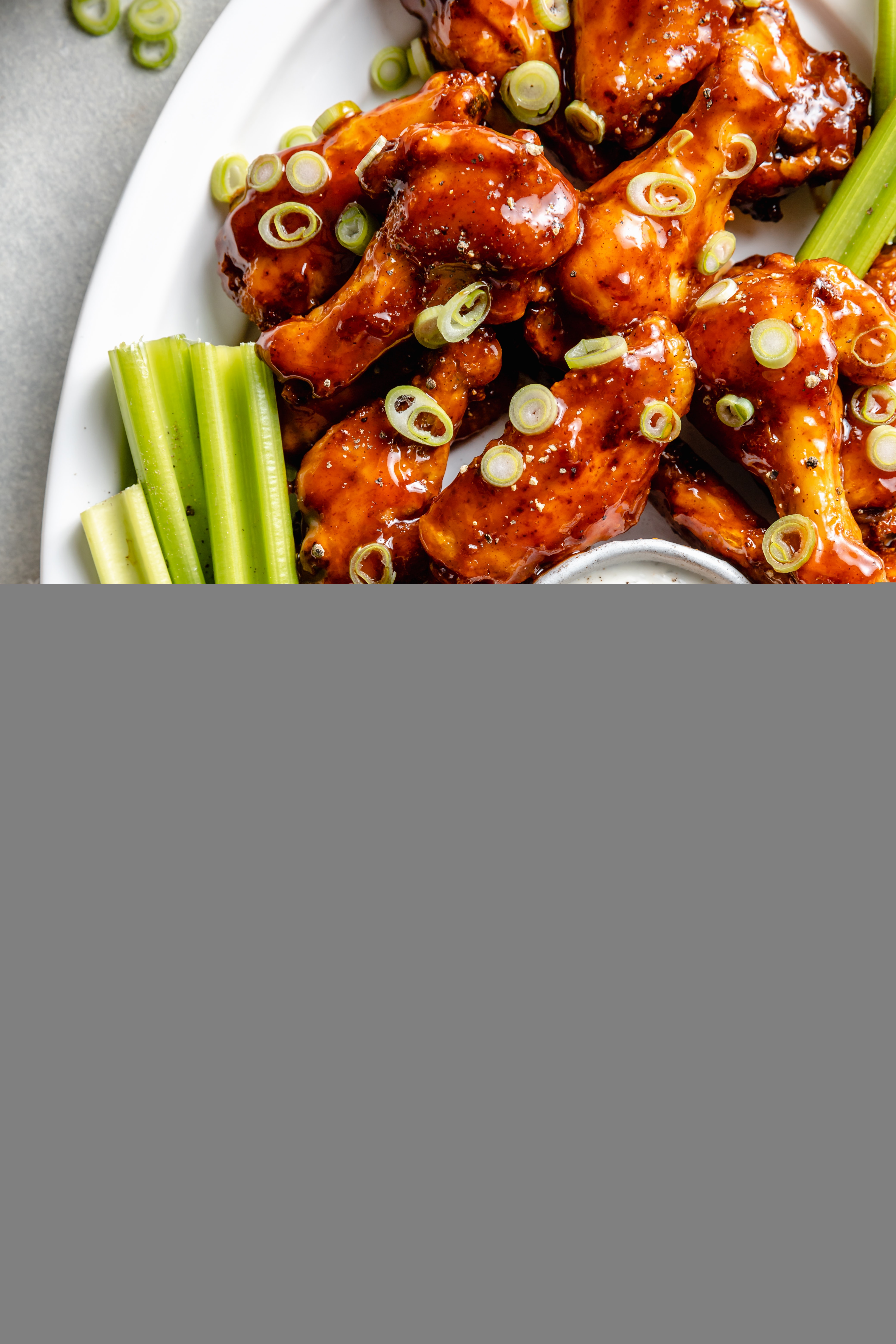 bbq chicken wings on platter with dip
