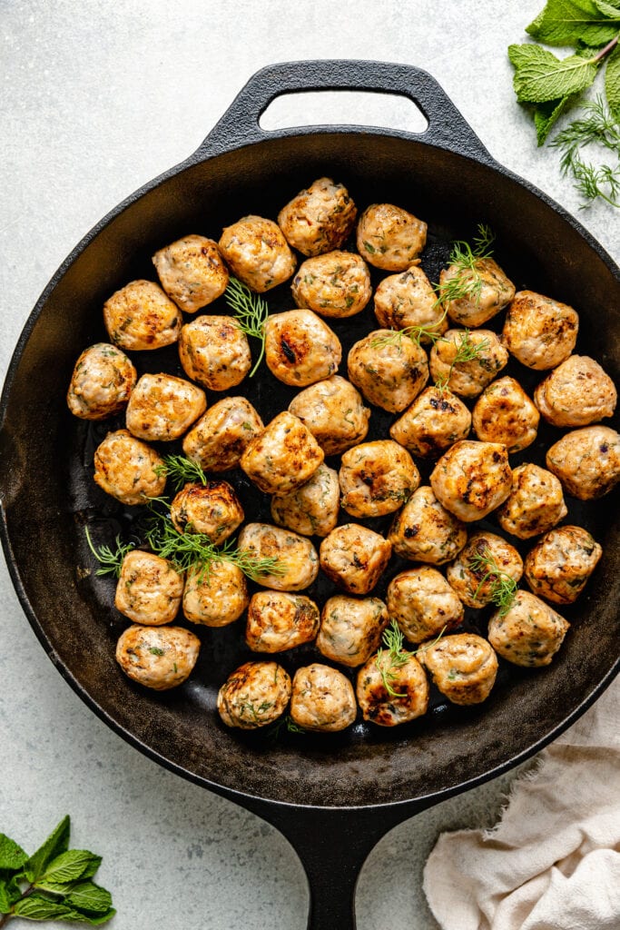 greek chicken meatballs in pan