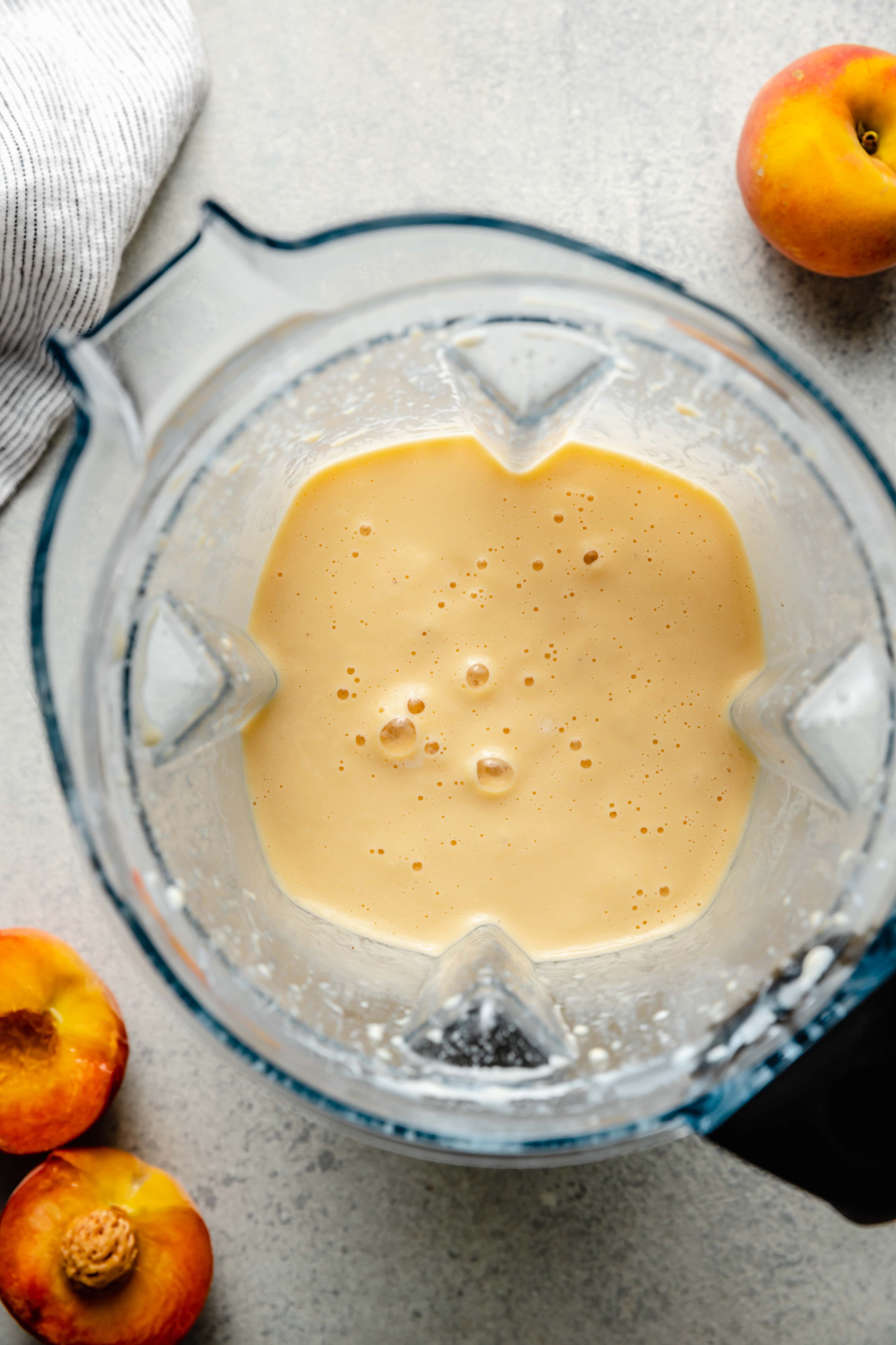 creamy peach smoothie in blender