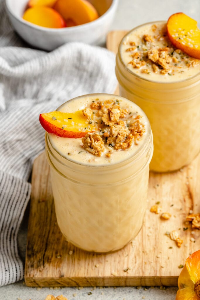 creamy peach smoothie in glass