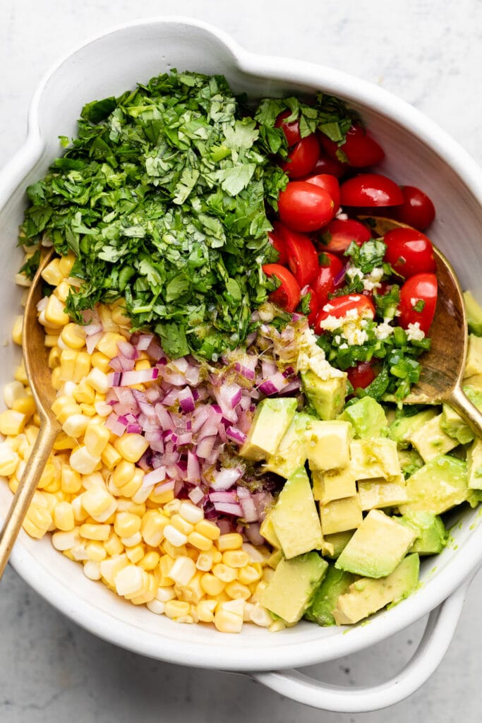 corn salad ingredients in mixing bowl