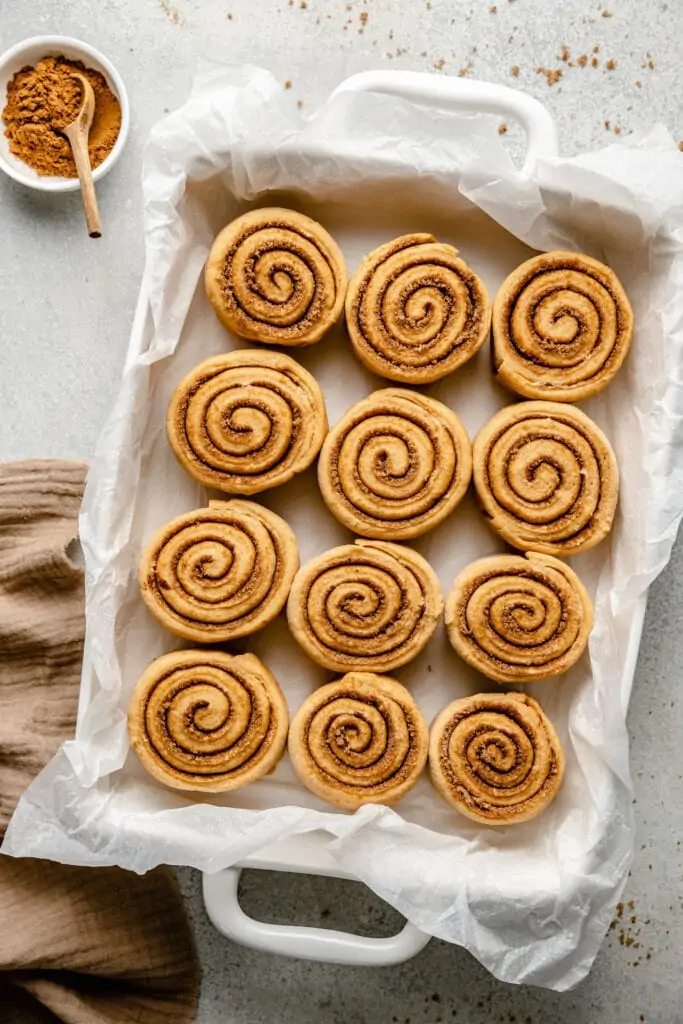pumpkin cinnamon rolls in baking dish