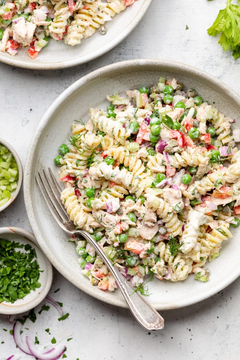tuna pasta salad in small bowl with spoon