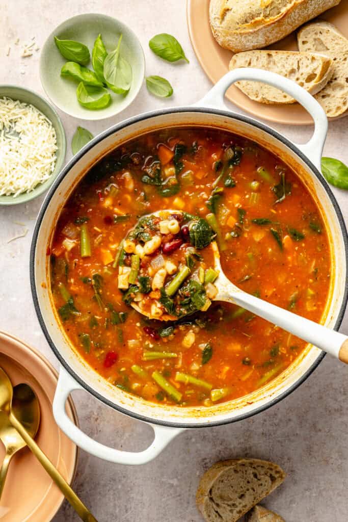 minestrone soup in pot with ladle