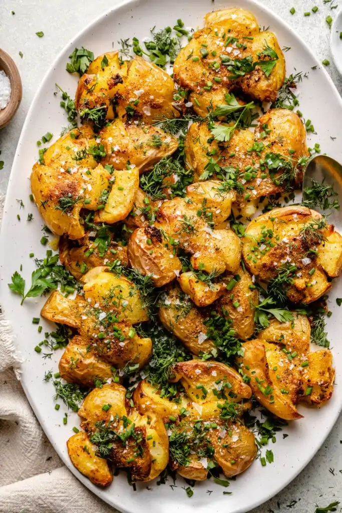 crispy smashed potatoes on platter