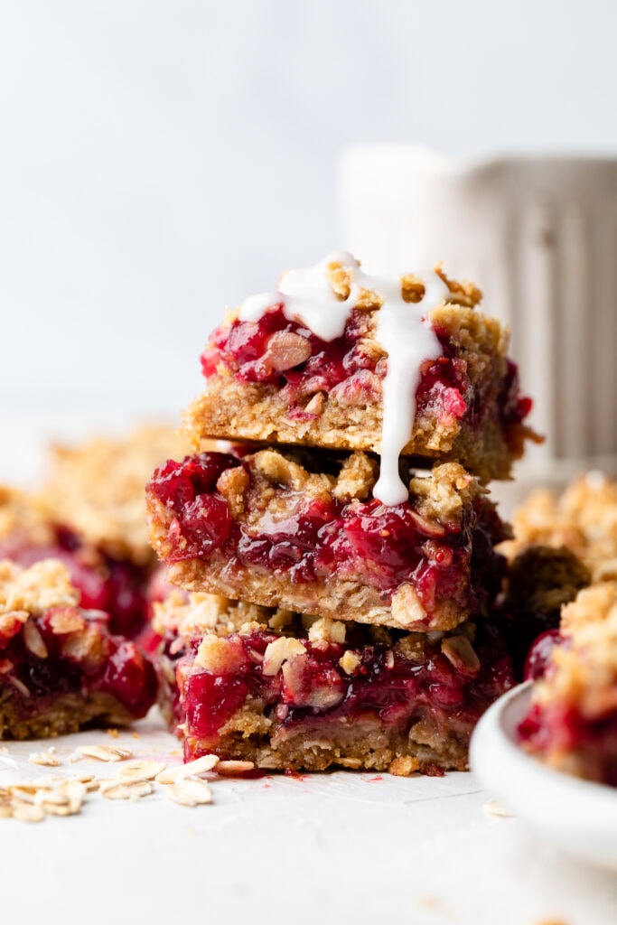 cranberry crumble bars stacked on each other